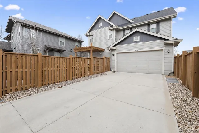 a front view of a house with a garage