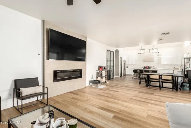 a kitchen with stainless steel appliances kitchen island granite countertop a sink and cabinets