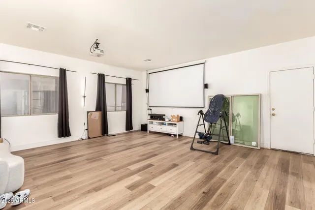 a bedroom with furniture and a window