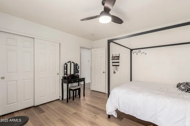 a bathroom with a double vanity sink toilet and shower