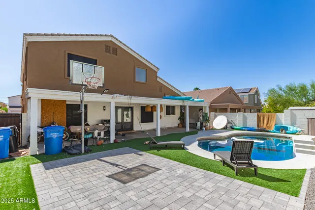 a view of a swimming pool with a lounge chairs