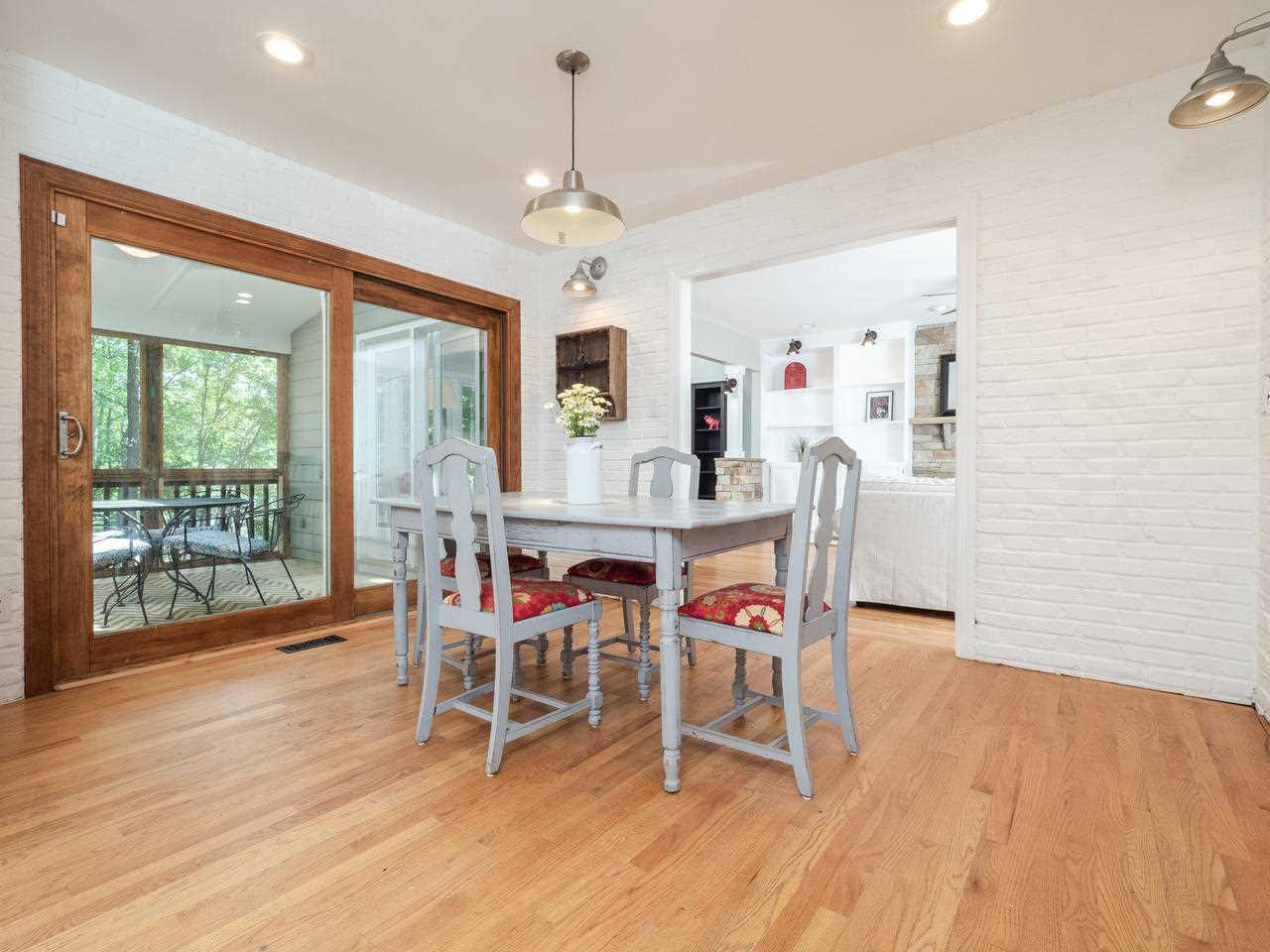 12100 Warwickshire Way Raleigh, NC 27613 - Photo 8 of 29 Breakfast nook with exposed brick wall