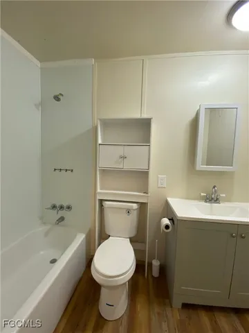 a bathroom with a toilet a sink and bathtub