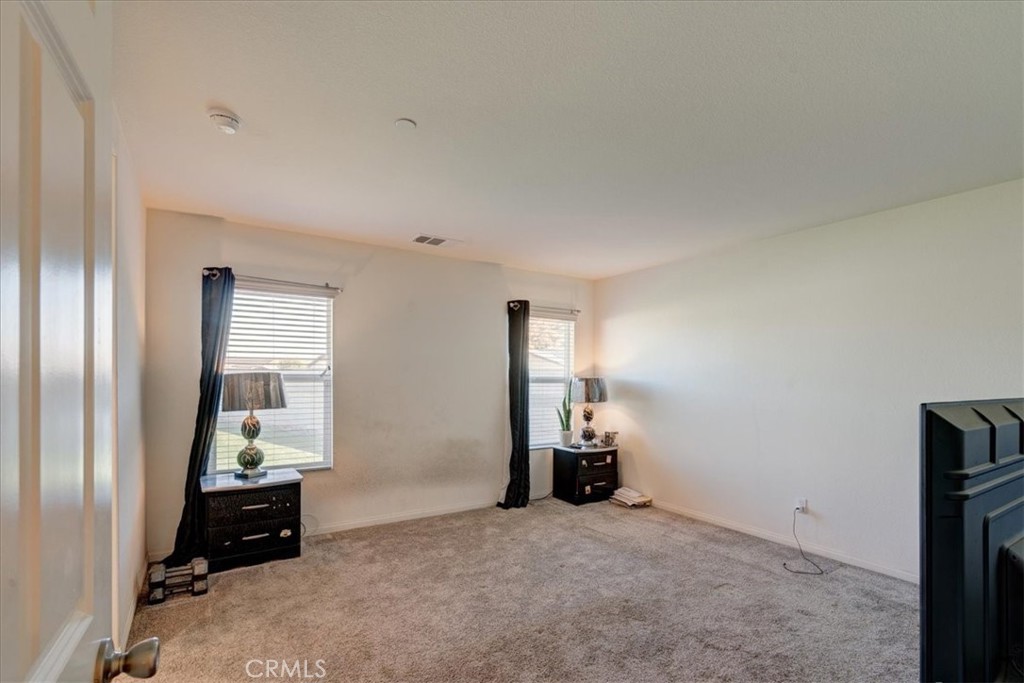 26602 C. Cantera Menifee, CA 92585 - Photo 9 of 14 a room with closet and mirror