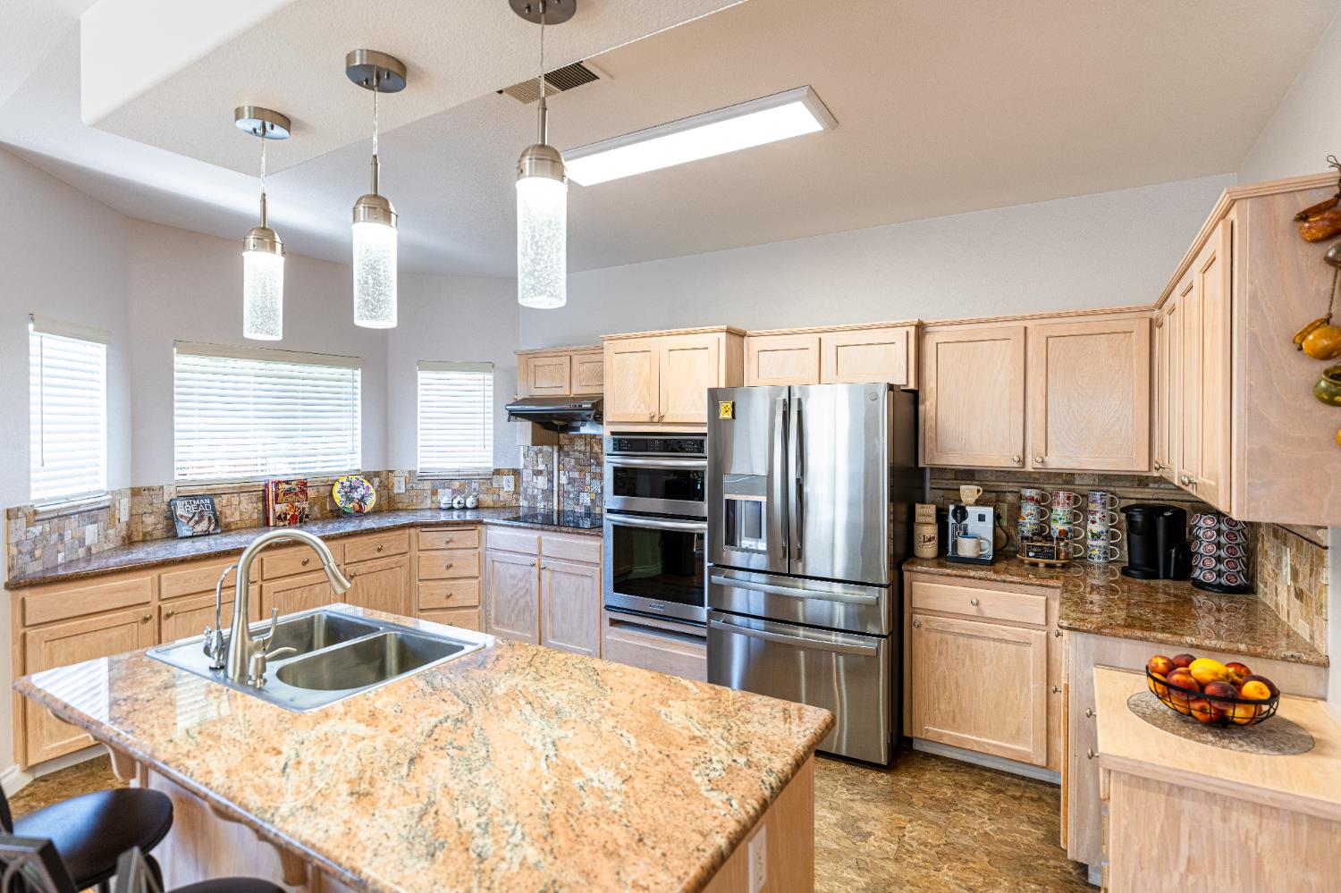 2322 East Revere Road Fresno, CA 93720 - Photo 15 of 33 a kitchen with granite countertop a sink stainless steel appliances and counter space