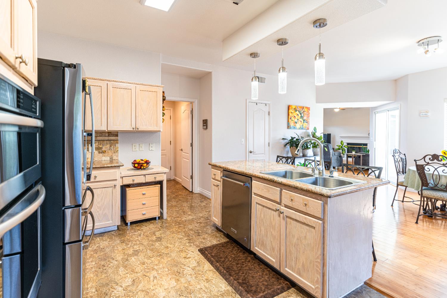 2322 East Revere Road Fresno, CA 93720 - Photo 17 of 33 a kitchen with stainless steel appliances granite countertop a sink stove and refrigerator