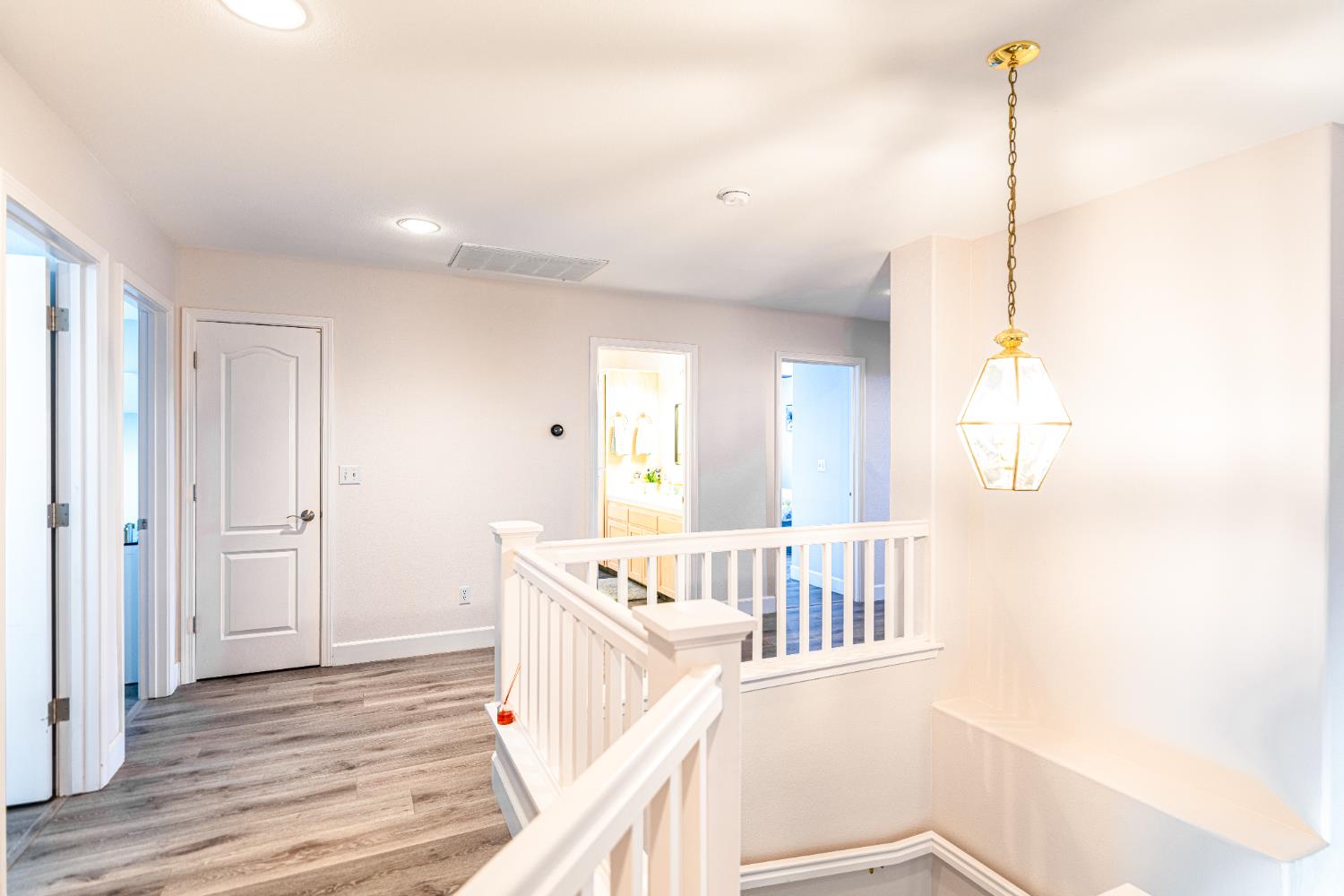 2322 East Revere Road Fresno, CA 93720 - Photo 19 of 33 a view of a hallway with windows
