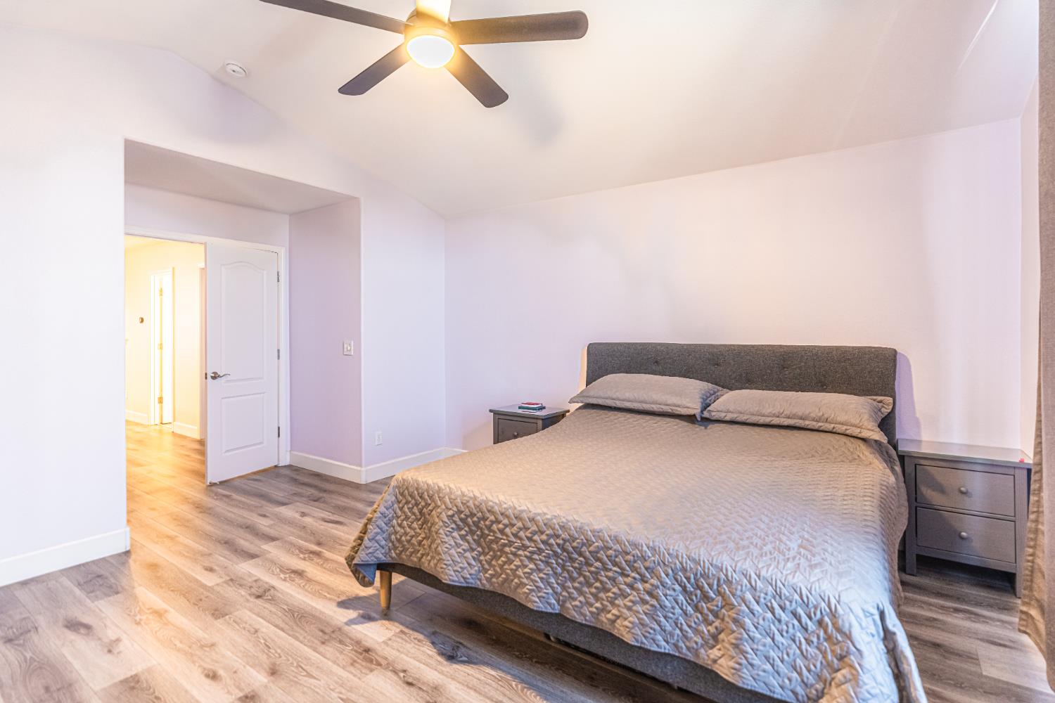 2322 East Revere Road Fresno, CA 93720 - Photo 21 of 33 a bedroom with a bed and a dresser