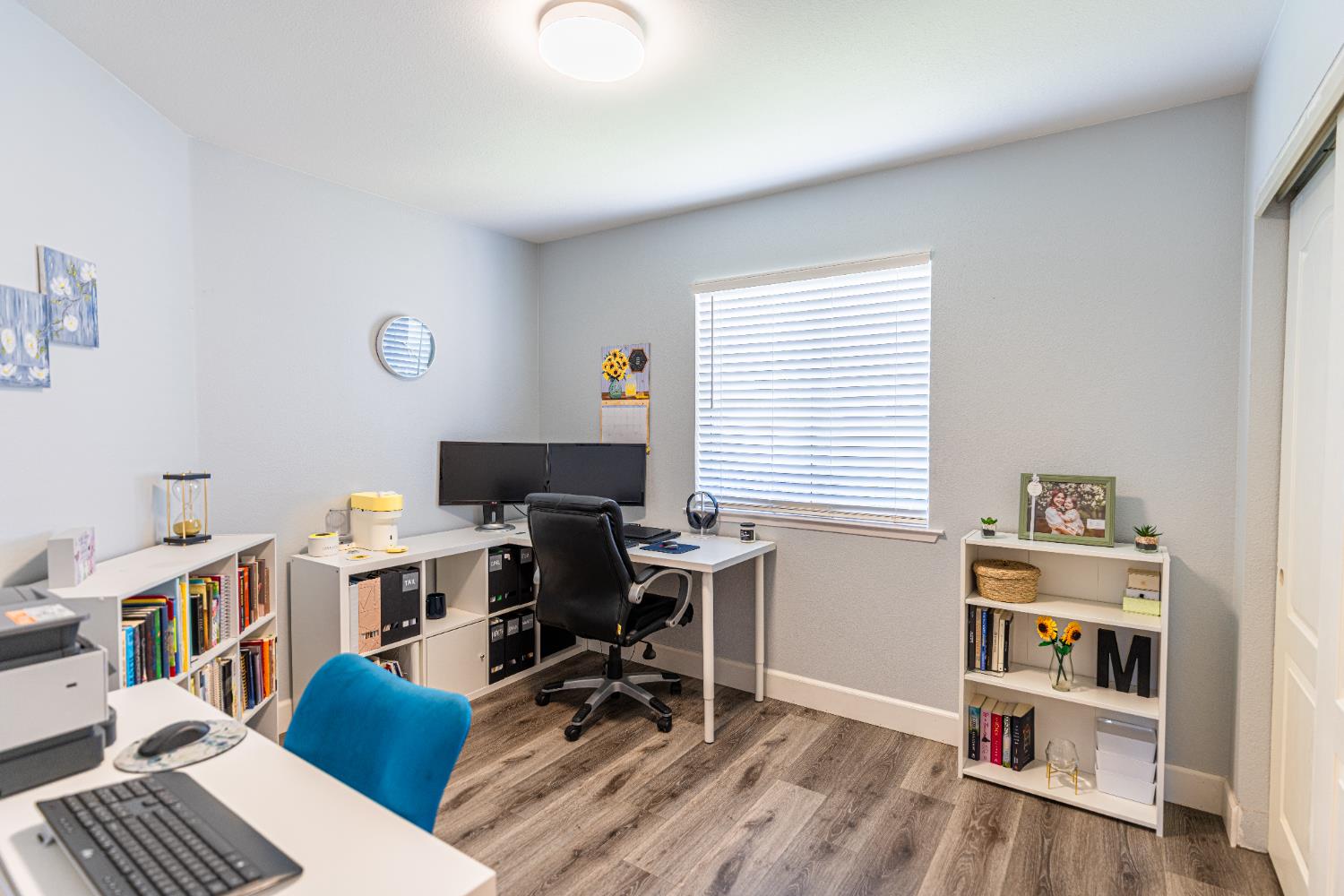 2322 East Revere Road Fresno, CA 93720 - Photo 22 of 33 a view of a workspace with furniture and a window