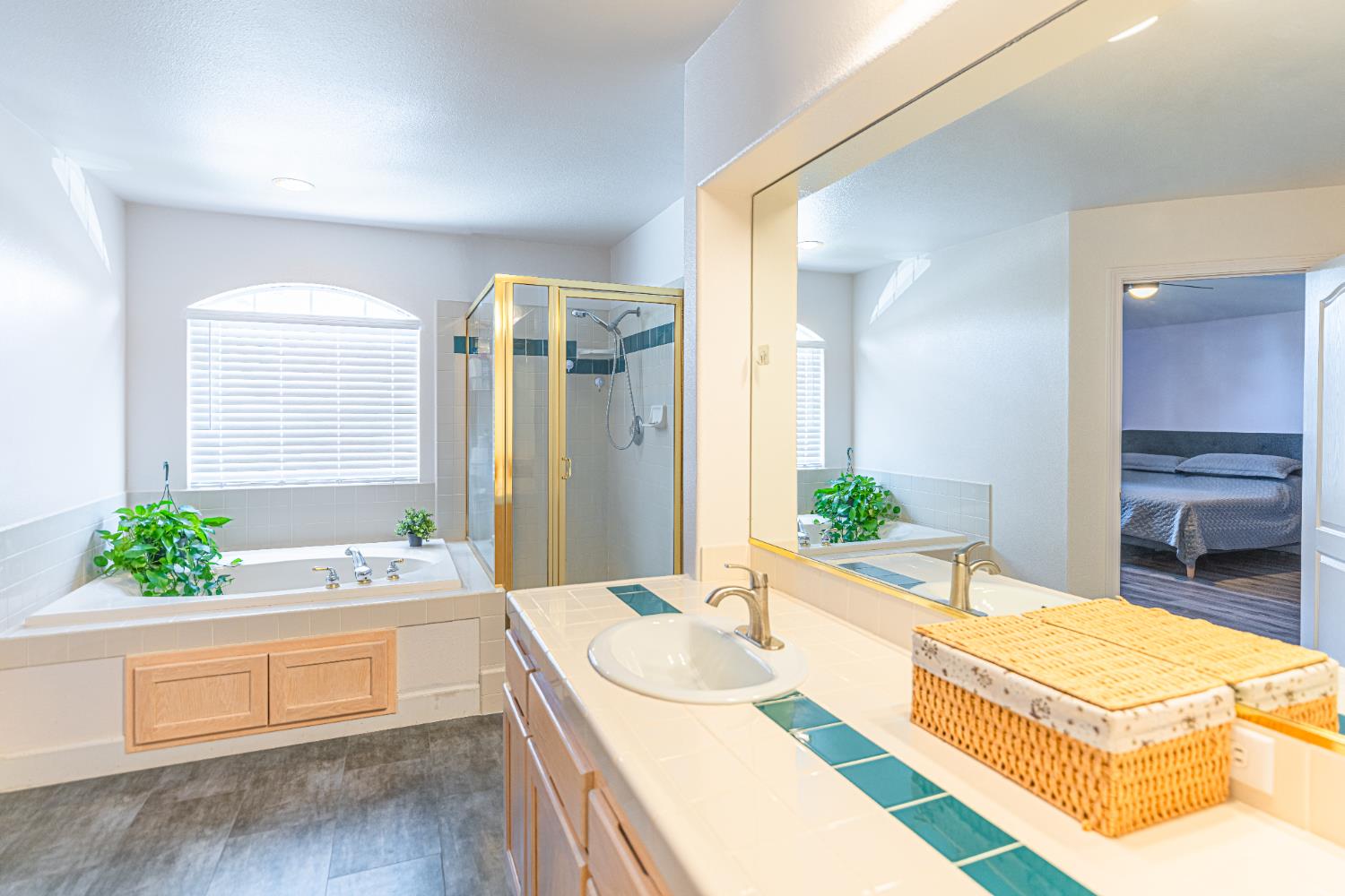 2322 East Revere Road Fresno, CA 93720 - Photo 24 of 33 a spacious bathroom with a granite countertop tub and a large window