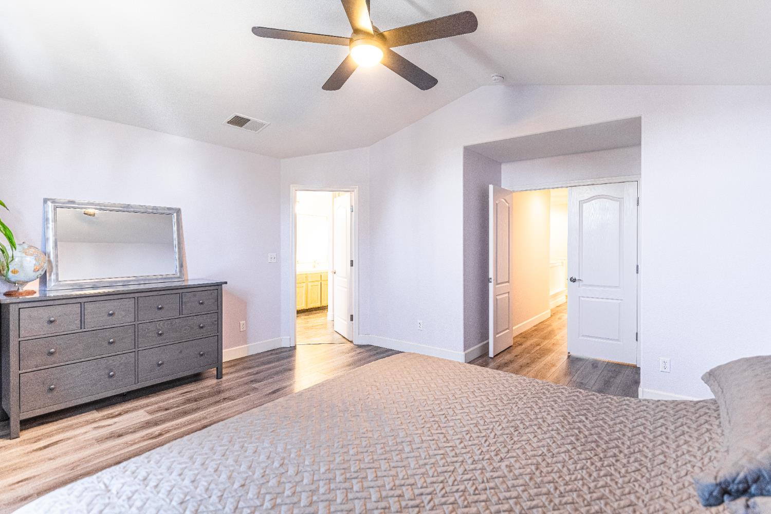 2322 East Revere Road Fresno, CA 93720 - Photo 28 of 33 a bedroom with a bed and a dresser
