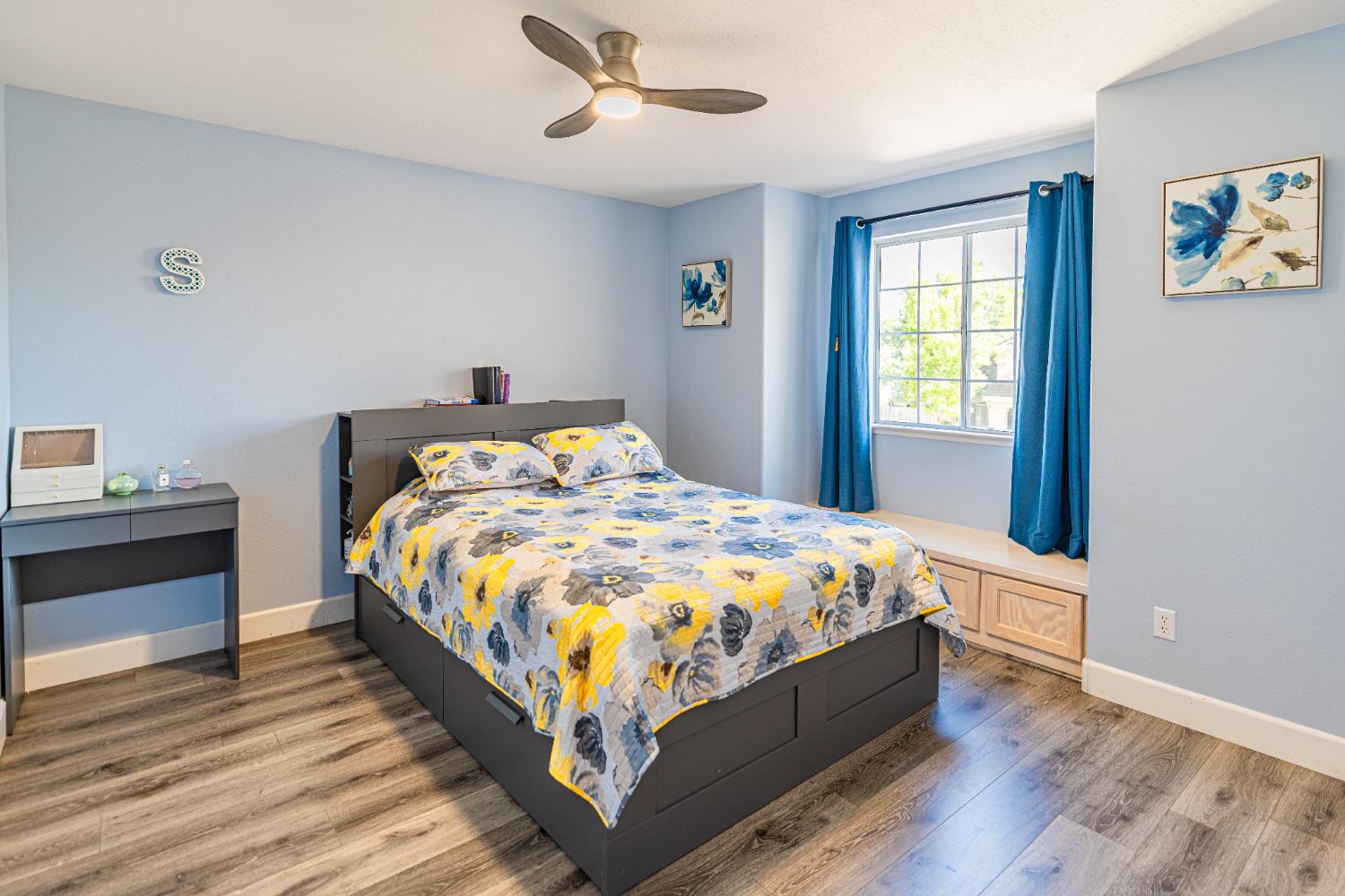 2322 East Revere Road Fresno, CA 93720 - Photo 29 of 33 a large bed sitting in a bedroom next to a window