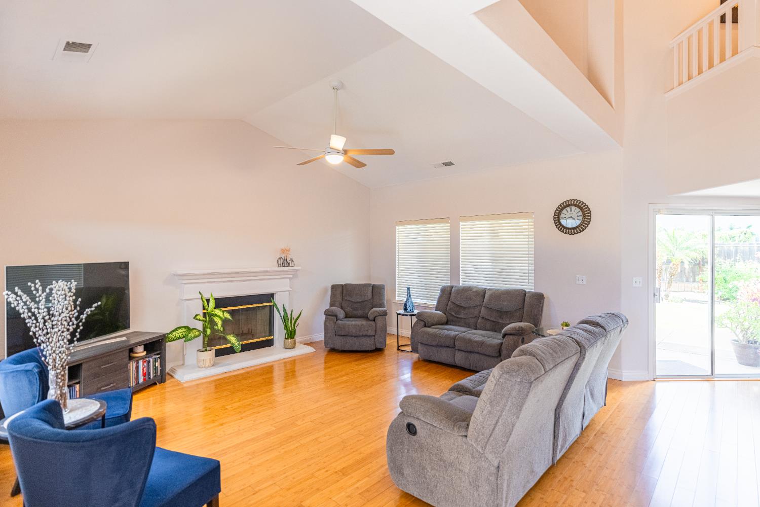 2322 East Revere Road Fresno, CA 93720 - Photo 5 of 33 a living room with furniture and a fireplace