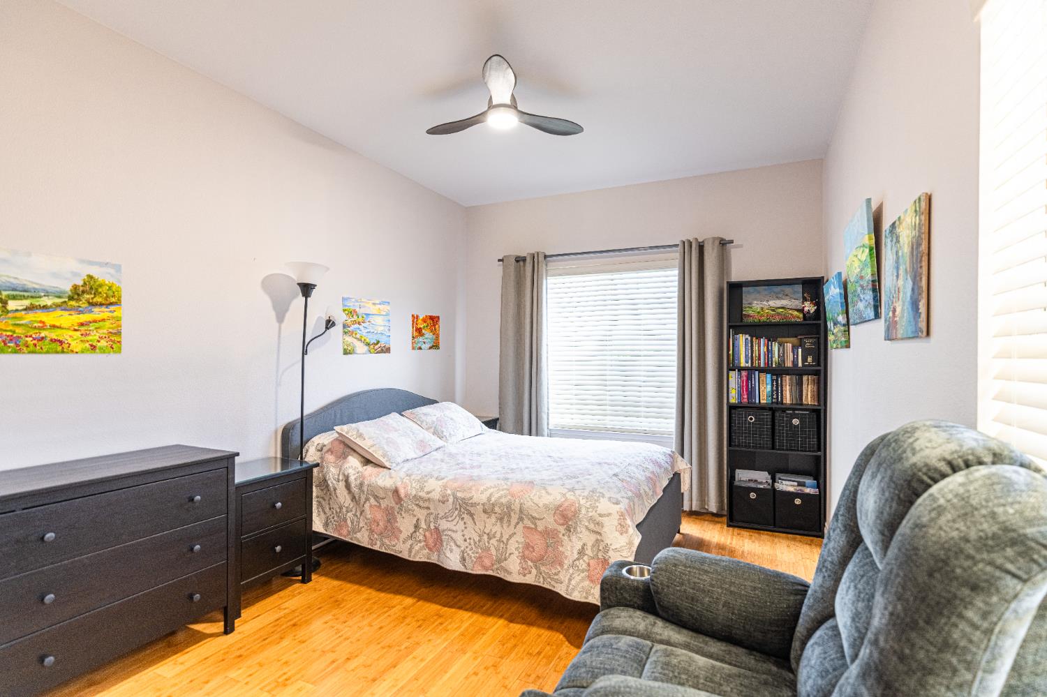 2322 East Revere Road Fresno, CA 93720 - Photo 9 of 33 a bedroom with a bed and a chandelier