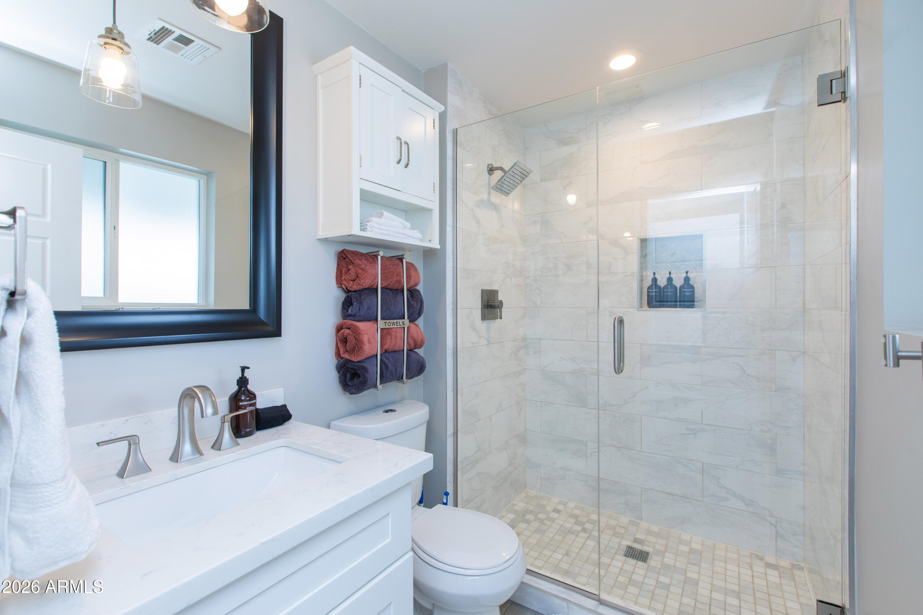 5541 East Cheery Lynn Road Phoenix, AZ 85018 - Photo 43 of 69 a bathroom with a sink toilet a mirror and shower