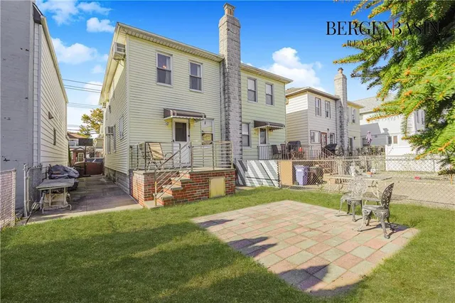 a view of a house with a porch and sitting area