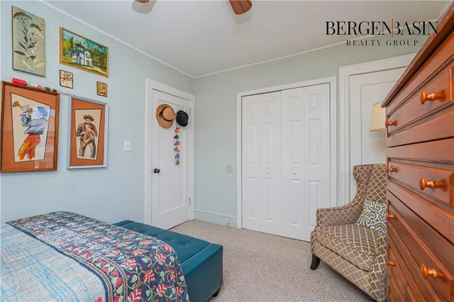 a bedroom with a bed and a couch