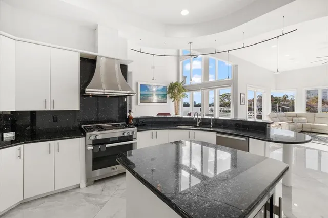 a view of a dining room with furniture and chandelier