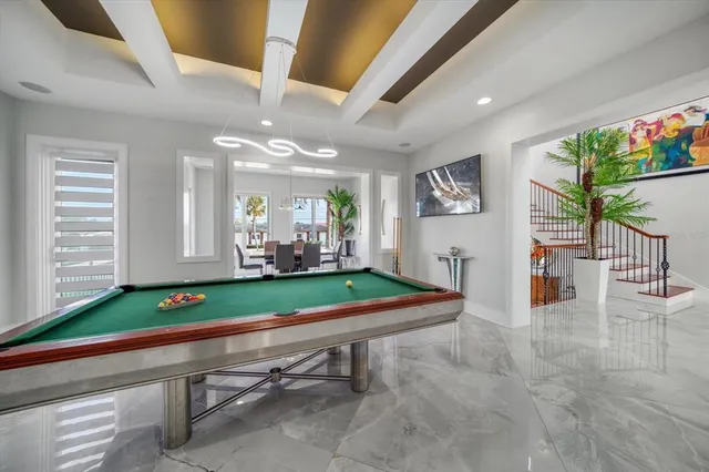 a bathroom with a granite countertop sink a toilet a mirror and shower