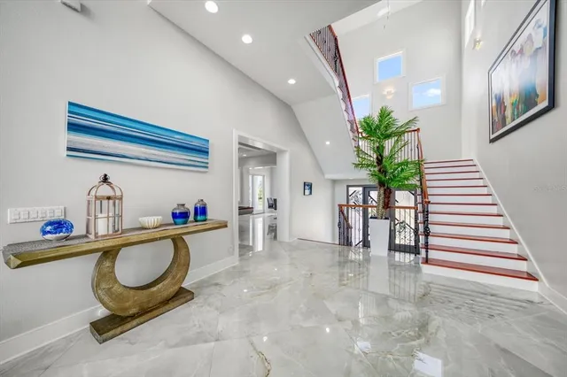 a view of staircase with railing and stairs