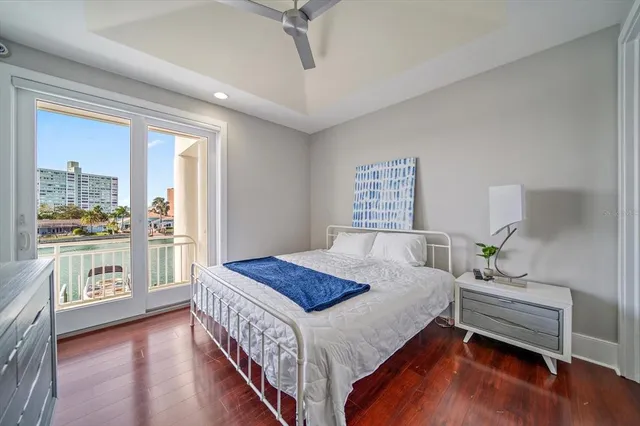 a view of a roof deck with couches and wooden floor