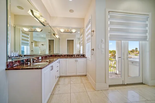 a open kitchen with stainless steel appliances granite countertop a stove and a sink