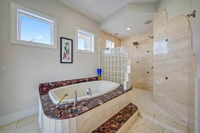 a view of a roof deck with furniture