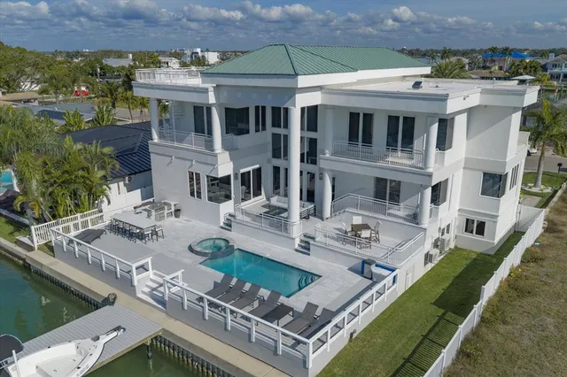 an aerial view of a houses with ocean view