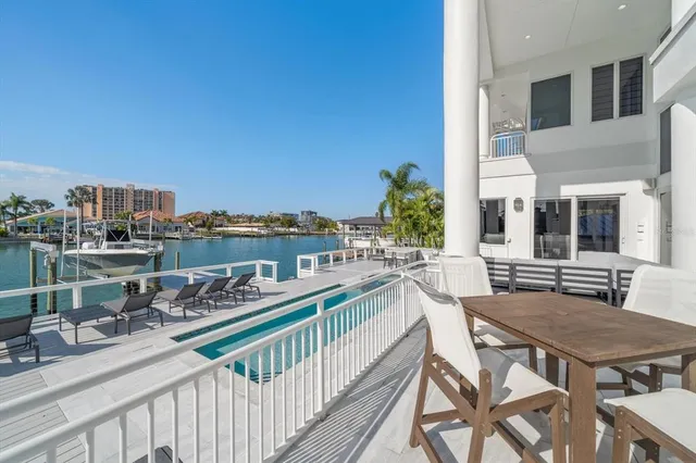 an aerial view of a house with a lake view