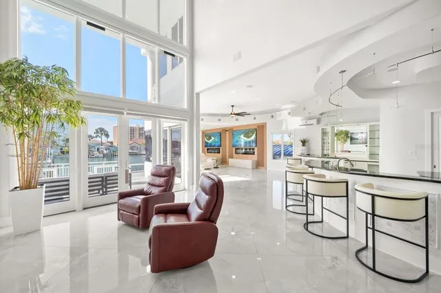 a living room with furniture a dining table and kitchen view