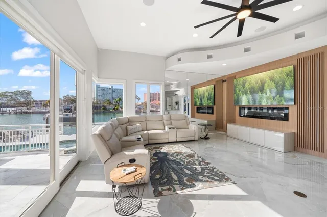 a kitchen with stainless steel appliances kitchen island granite countertop a table and chairs