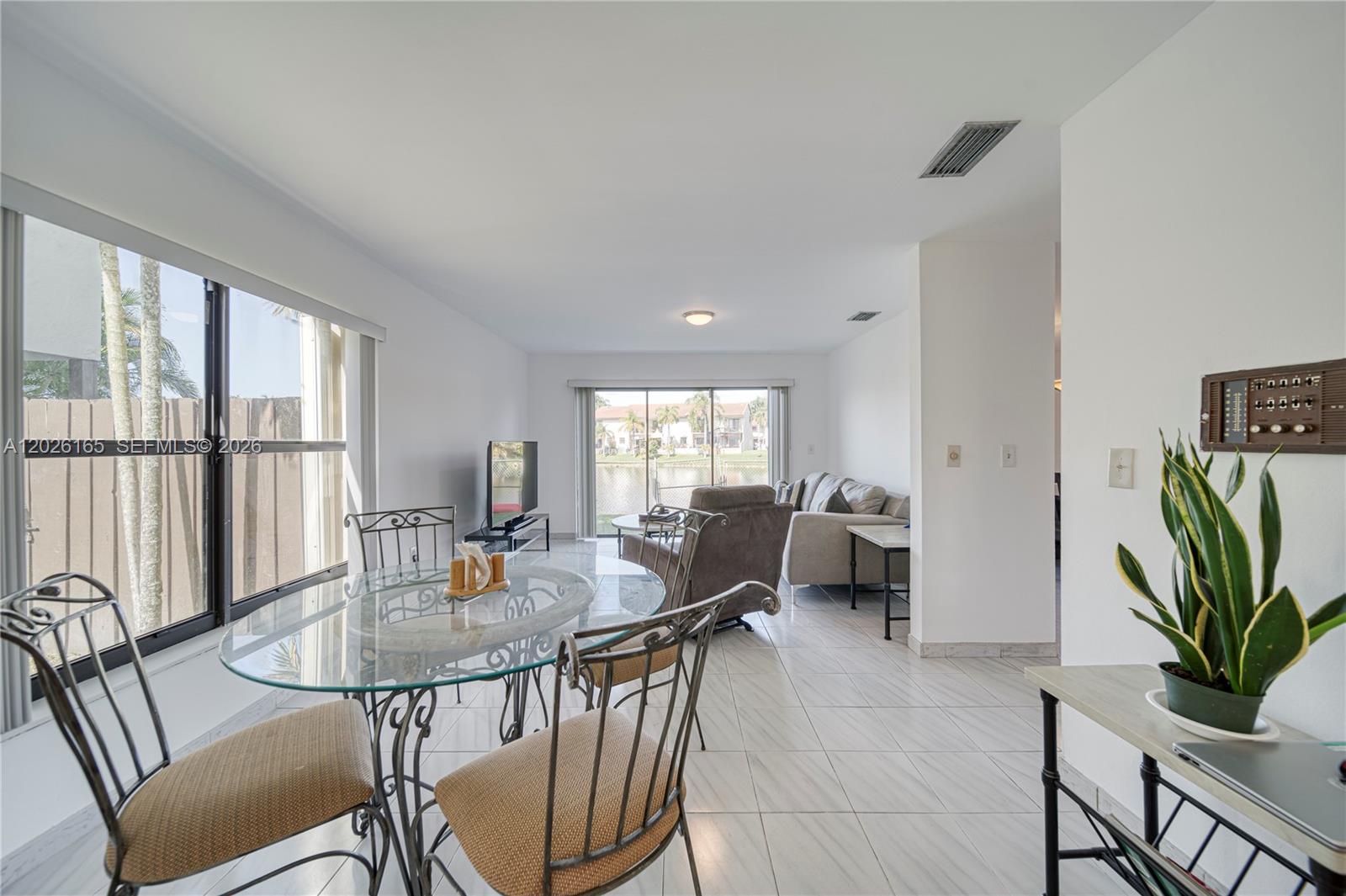 13337 Southwest 64th Lane Miami, FL 33183 - Photo 17 of 36 a view of a dining room with furniture window and outside view