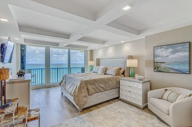 a bedroom with a bed and lamps