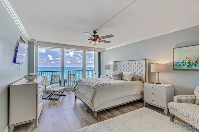 a balcony with table and chairs