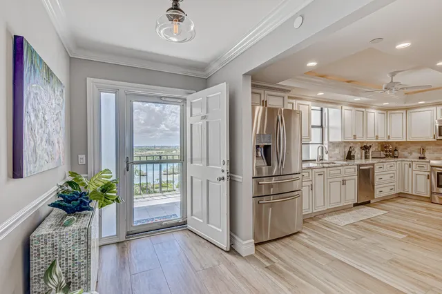 a kitchen with granite countertop appliances cabinets and a sink