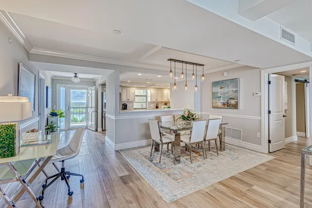 a view of a workspace room with furniture and wooden floor