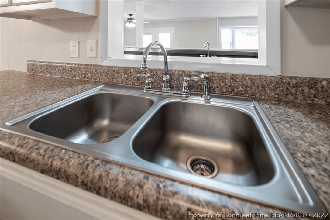 6614 Wake Forest Road Fayetteville, NC 28311 - Photo 22 of 48 a close view of sink and tap