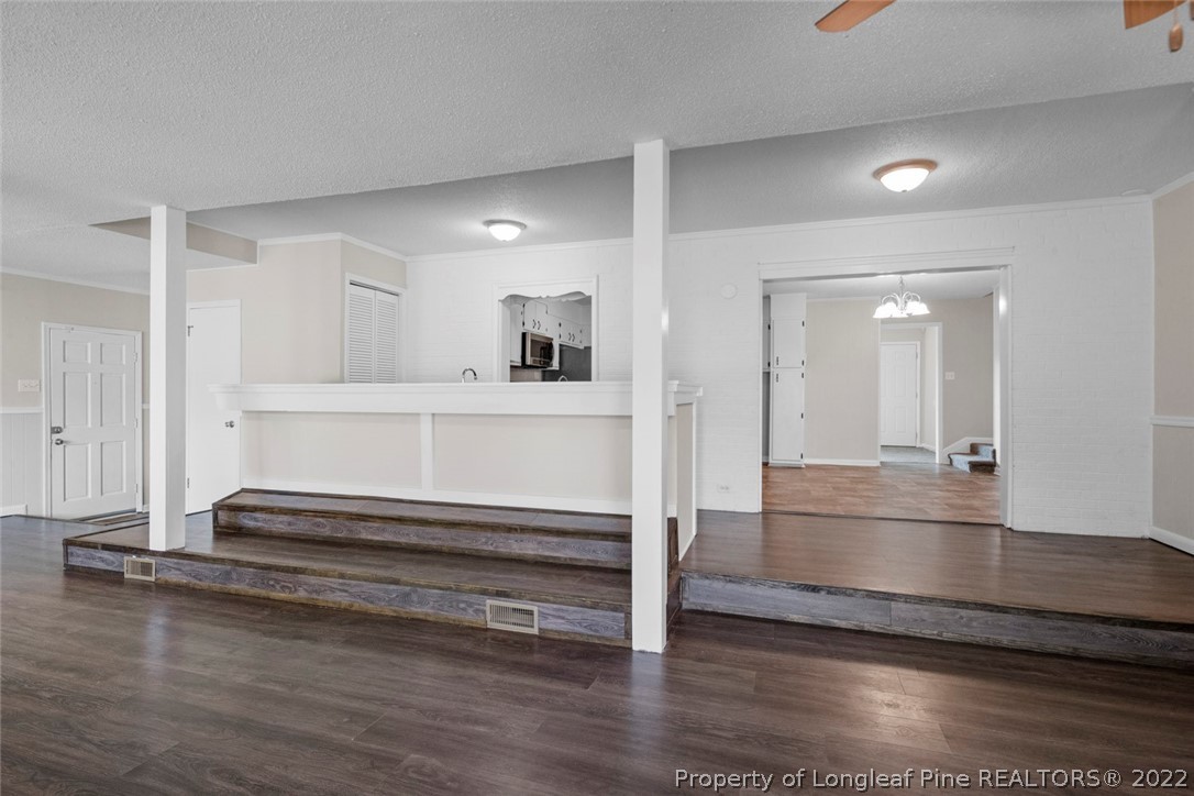 6614 Wake Forest Road Fayetteville, NC 28311 - Photo 30 of 48 a view of entryway with wooden floor
