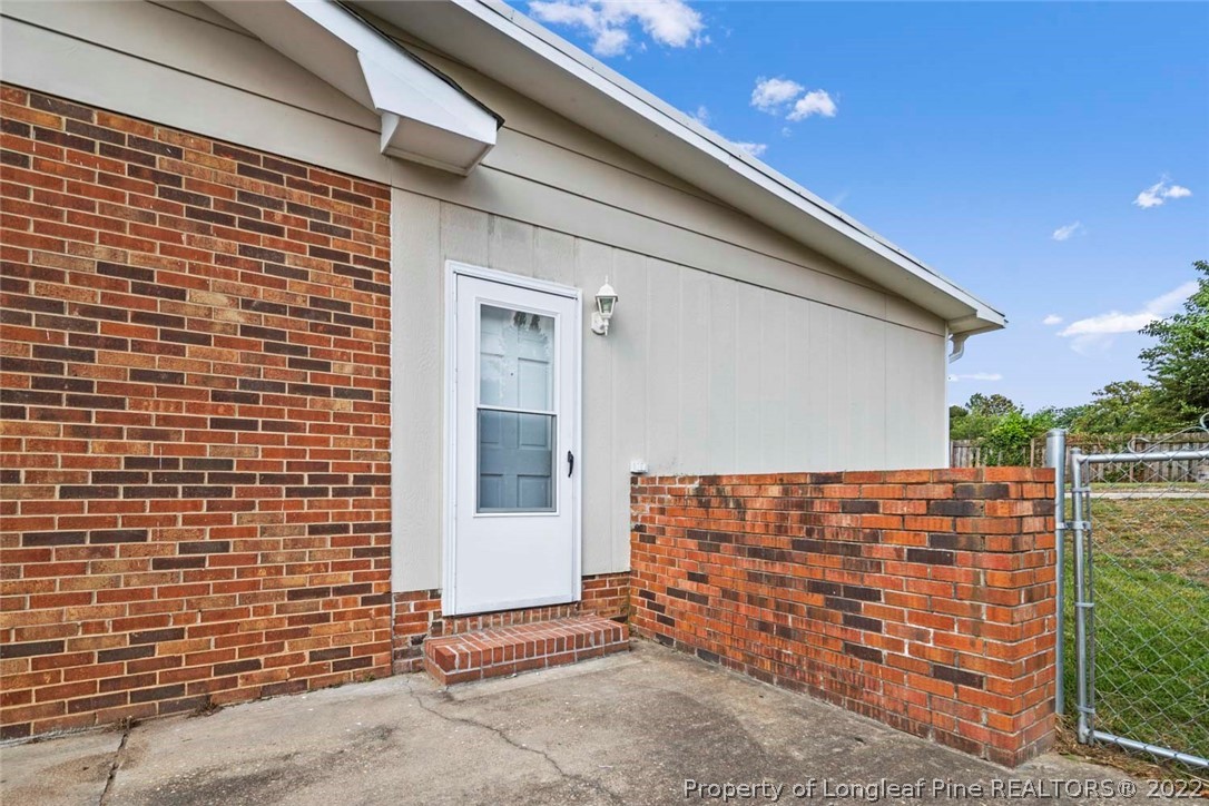 6614 Wake Forest Road Fayetteville, NC 28311 - Photo 4 of 48 a view of outdoor space and front door