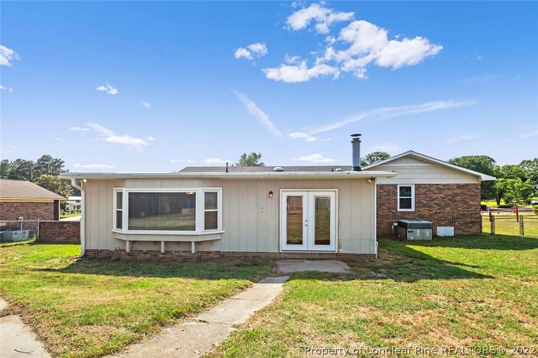 6614 Wake Forest Road Fayetteville, NC 28311 - Photo 48 of 48 a view of a house with swimming pool and a yard