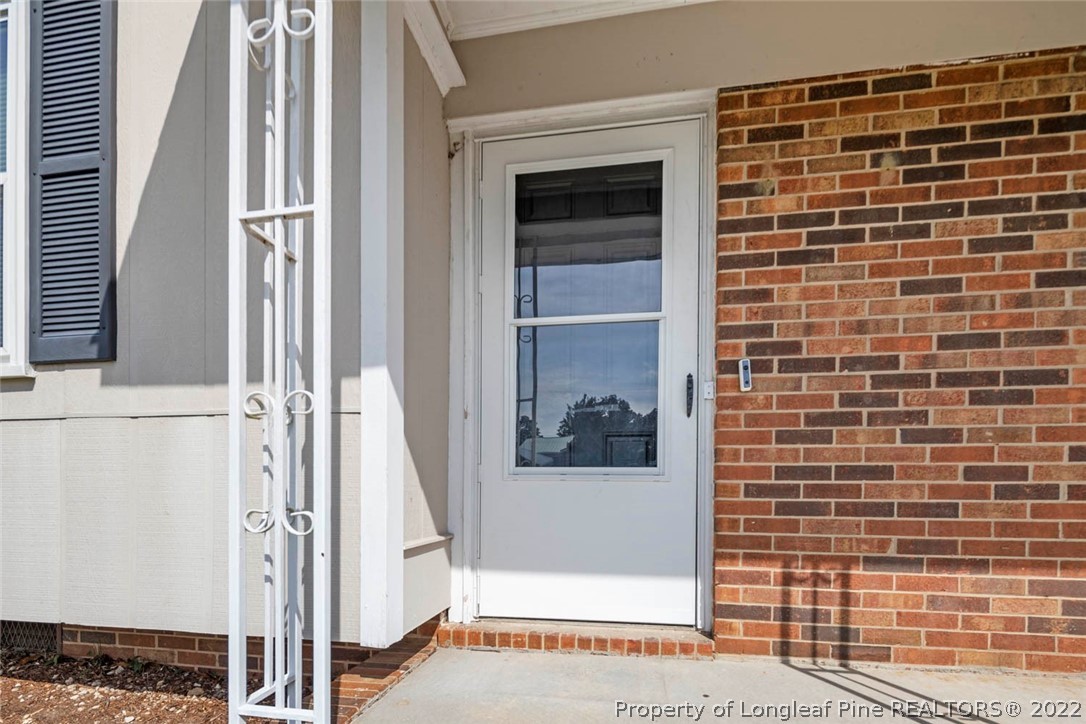6614 Wake Forest Road Fayetteville, NC 28311 - Photo 9 of 48 a view of front door of house
