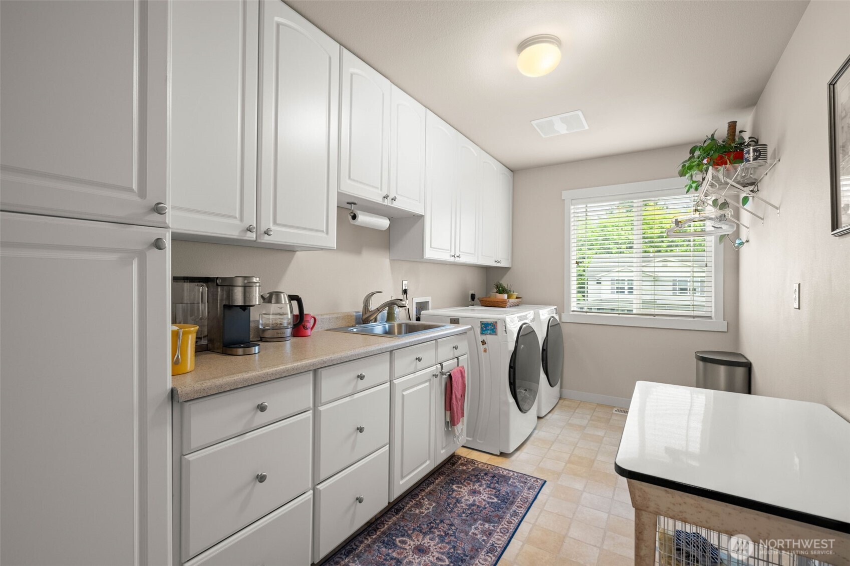 3114 Walker Road DuPont, WA 98327 - Photo 16 of 38 a kitchen with a white cabinets and window