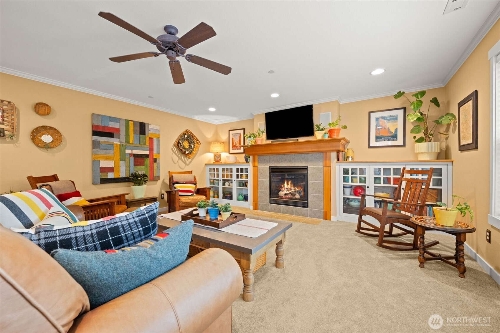 3114 Walker Road DuPont, WA 98327 - Photo 2 of 38 a living room with furniture a fireplace and a flat screen tv