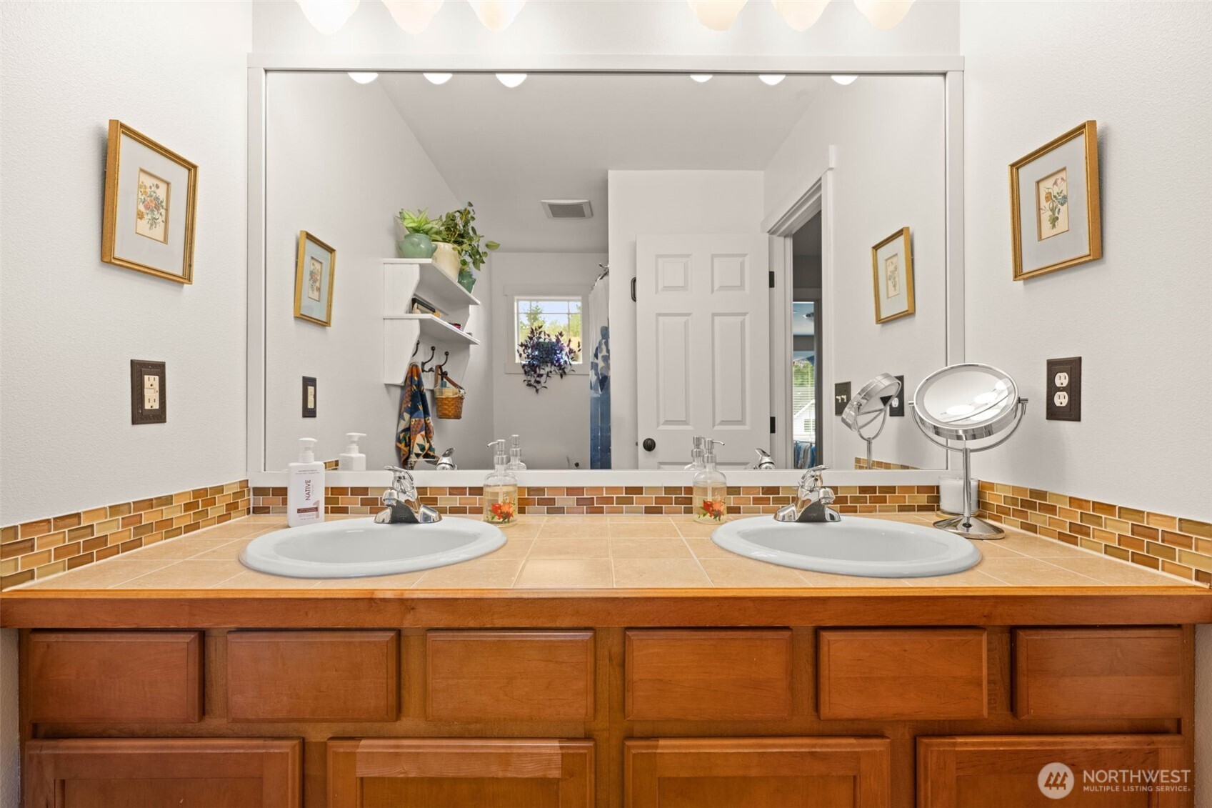 3114 Walker Road DuPont, WA 98327 - Photo 30 of 38 a bathroom with a sink and a mirror