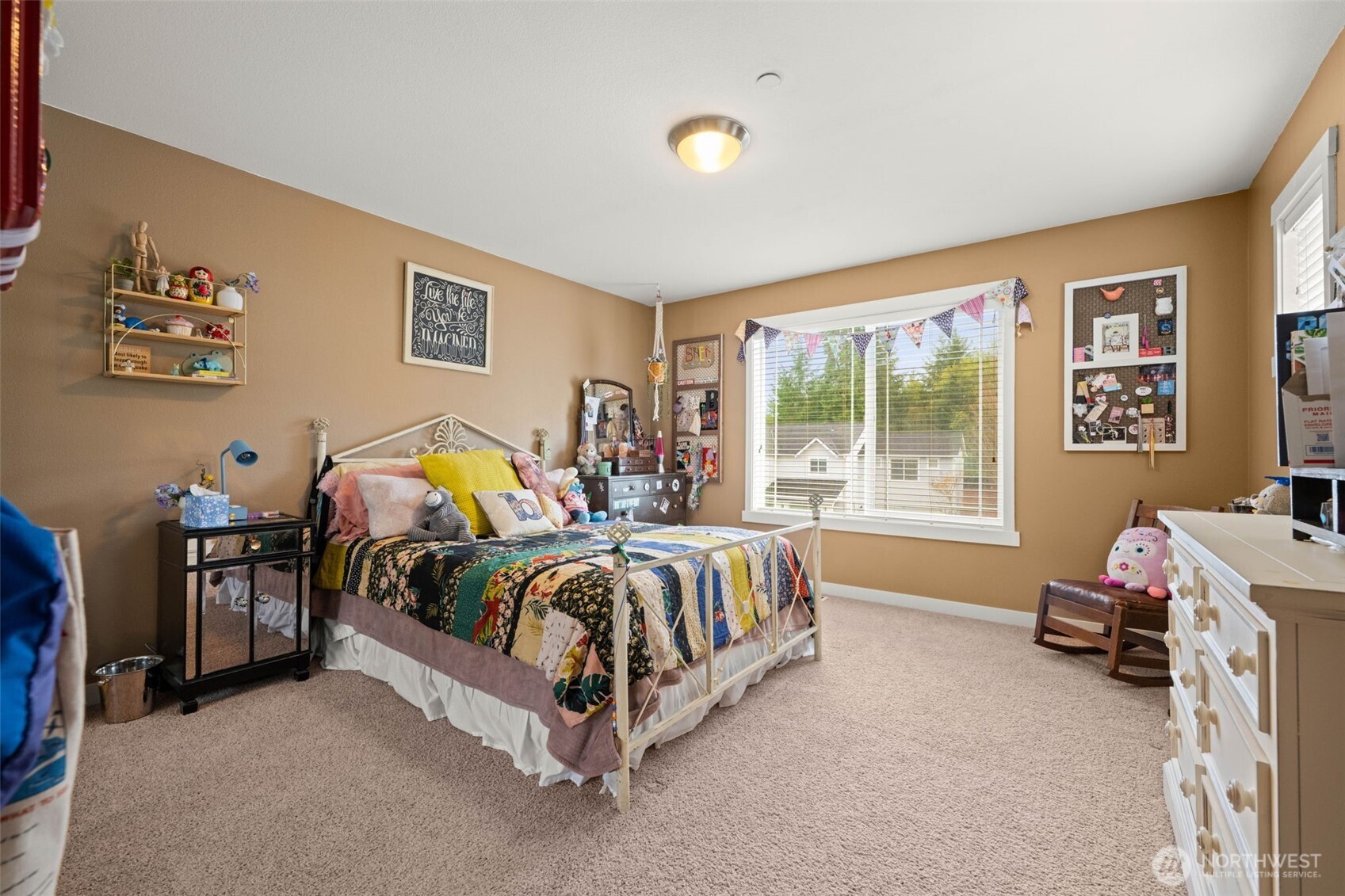 3114 Walker Road DuPont, WA 98327 - Photo 31 of 38 a bed sitting in a bedroom next to a window