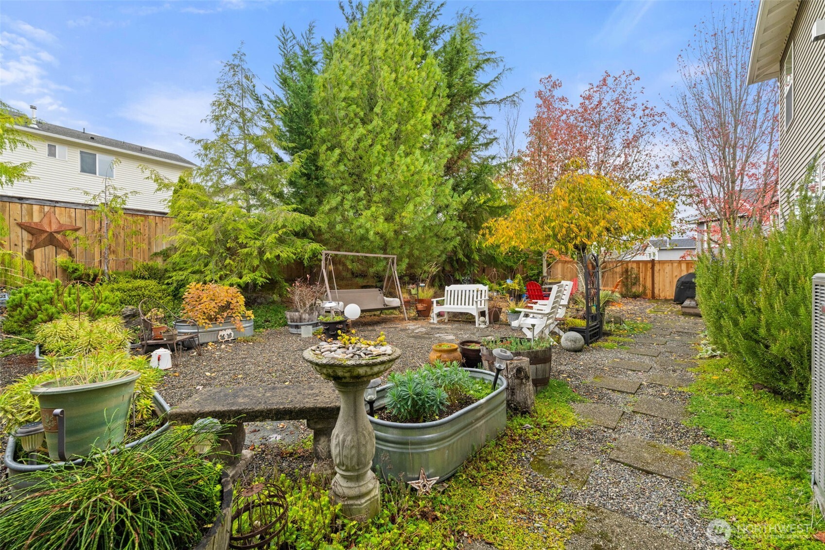 3114 Walker Road DuPont, WA 98327 - Photo 35 of 38 a view of a backyard with plants and chairs