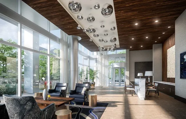 a living room with patio furniture and a large window