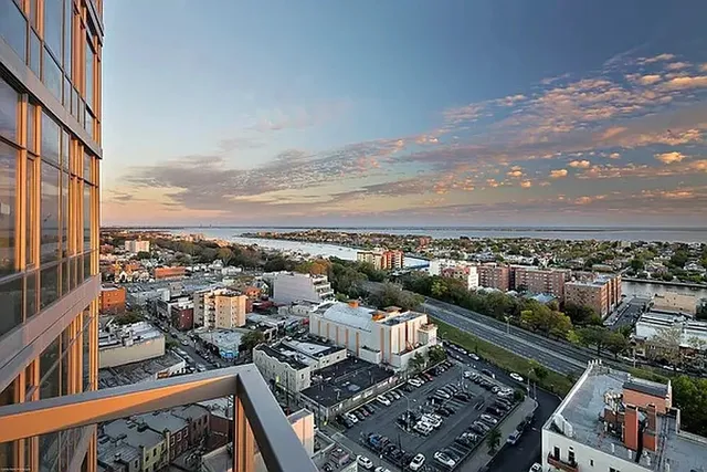 a kitchen with lots of clutter and cabinets