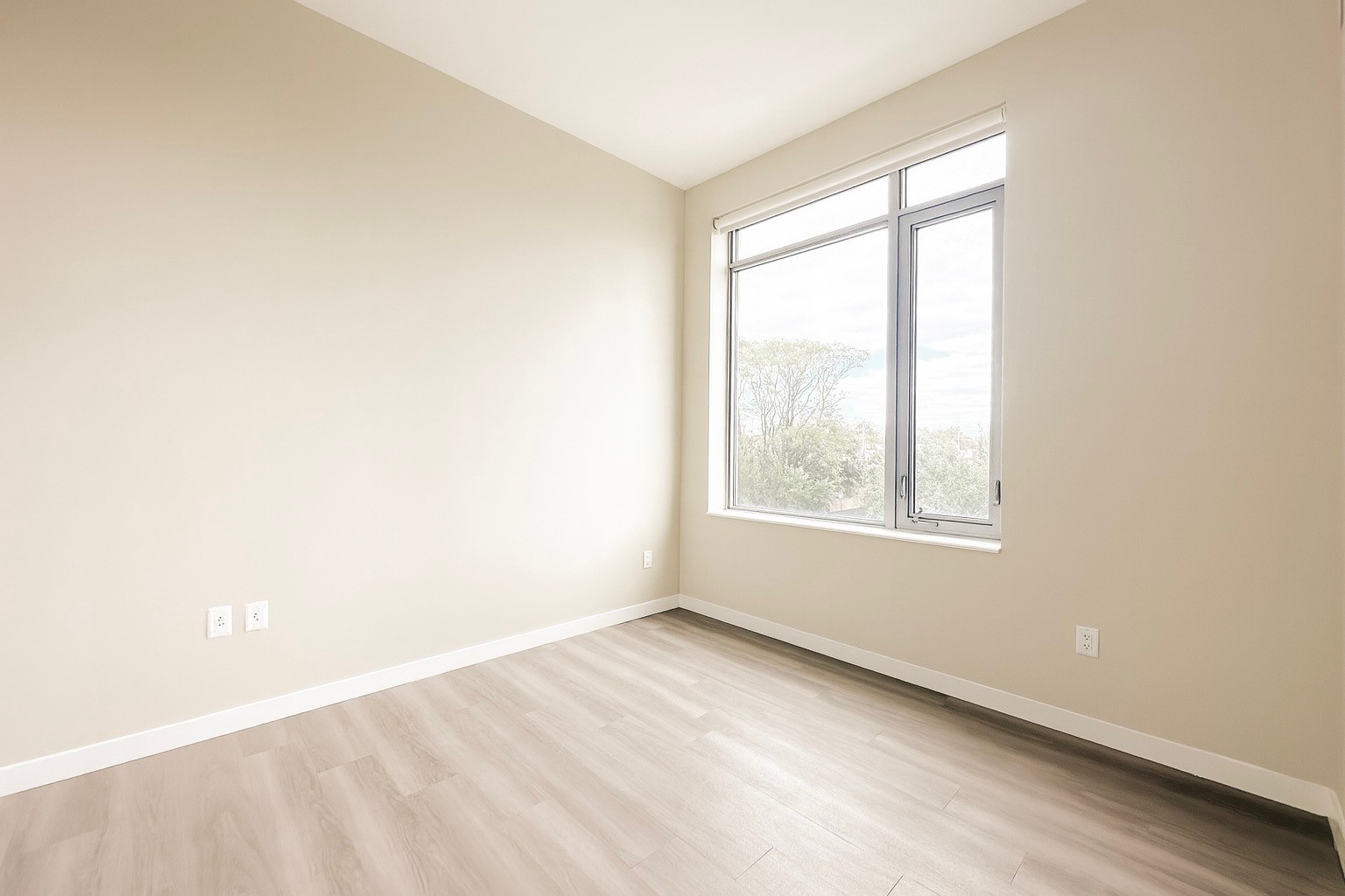 1524 Sheepshead Bay Road, Unit 3C Brooklyn, NY 11235 - Photo 2 of 25 an empty room with a window