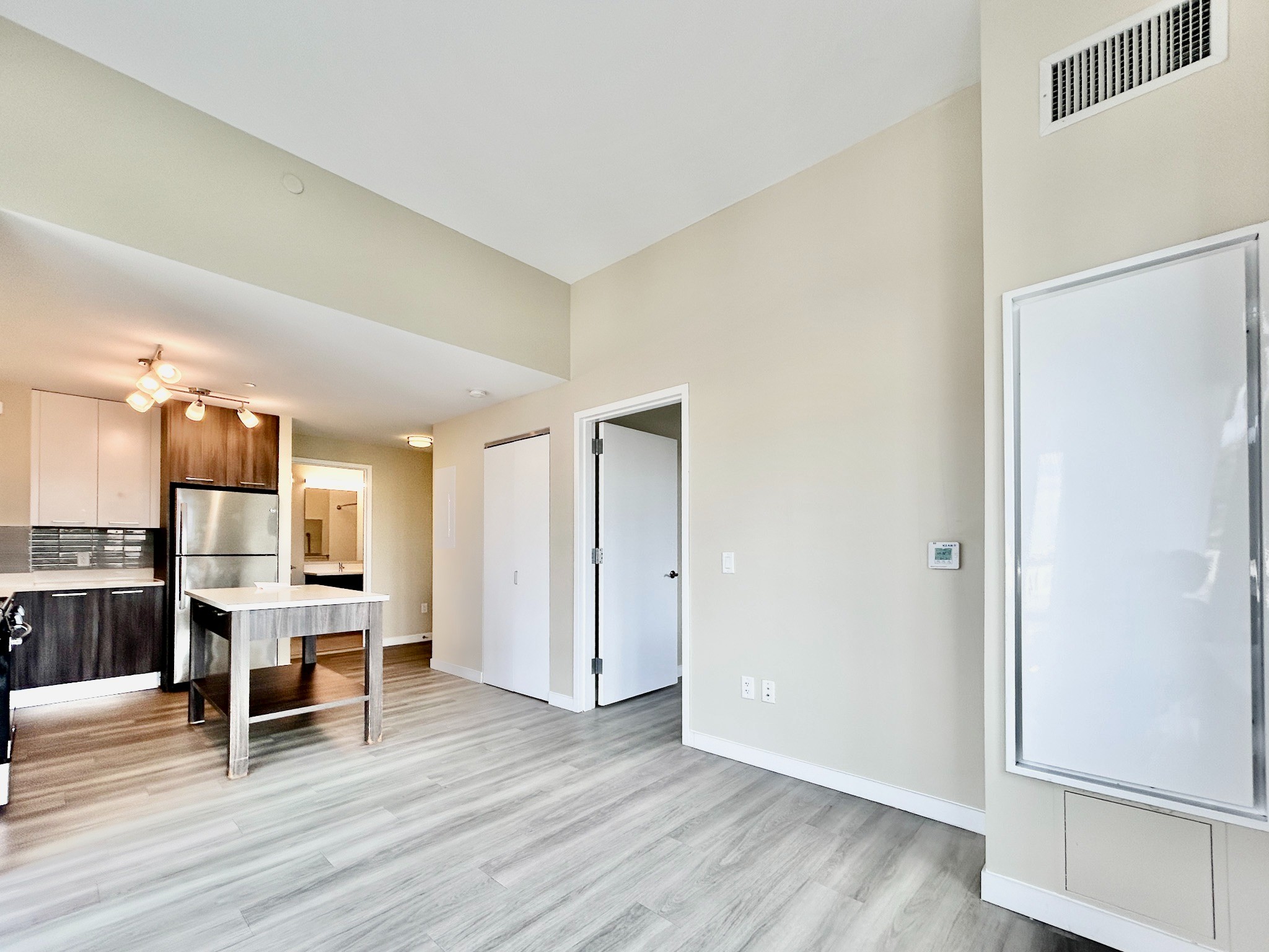 1524 Sheepshead Bay Road, Unit 3C Brooklyn, NY 11235 - Photo 5 of 25 a view of a livingroom with furniture and wooden floor